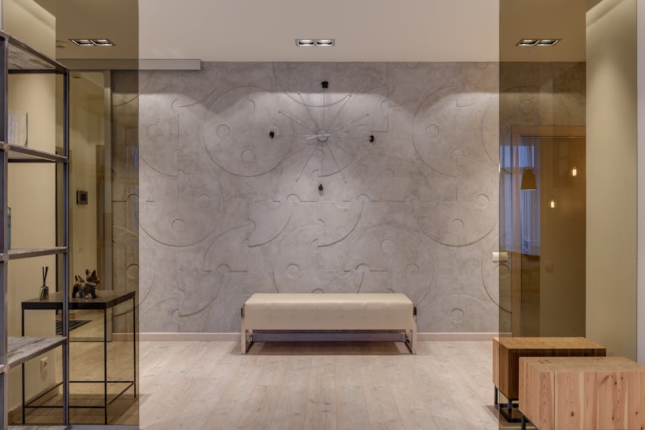 Interior of contemporary cozy hall with glass entrance and textured walls in flat