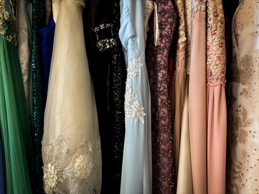 A collection of colorful vintage gowns showcasing intricate designs and embellishments.