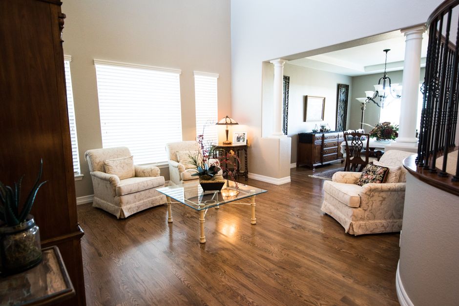 Spacious living room featuring classic furniture and elegant decor in a modern home setting.
