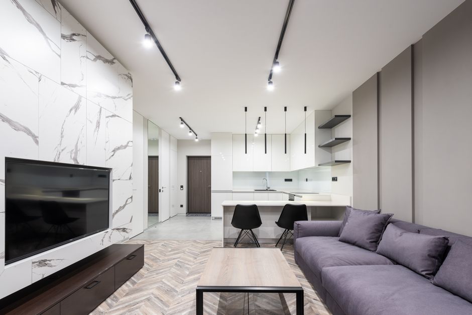 Explore a sleek, modern living room with minimalist design elements and a neutral palette.