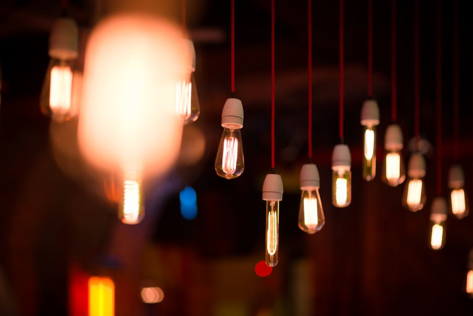 Warm vintage light bulbs hanging from the ceiling, creating a cozy and ambient glow.